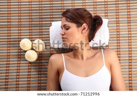 Beautiful woman lying on bamboo mat sleeping