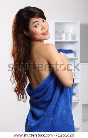 stock photo Beautiful japanese woman looking over shoulder wearing towel