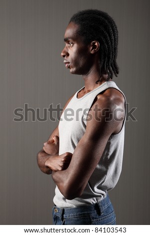view of tough young black African American man with short dreadlocks