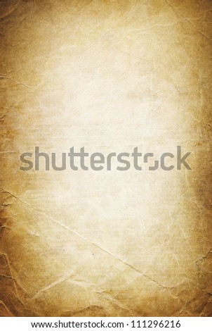 Vintage folded and torn old paper. Grunge classic background