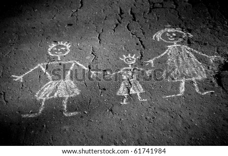 Old monochrome photography - family doodle. Picture on asphalt.