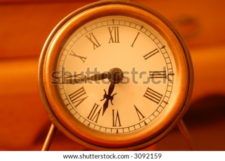 Small desktop clock with roman numerals