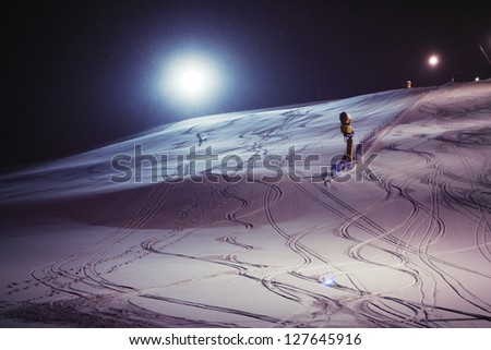 Night skiing on a snowy night - good for ski sports background