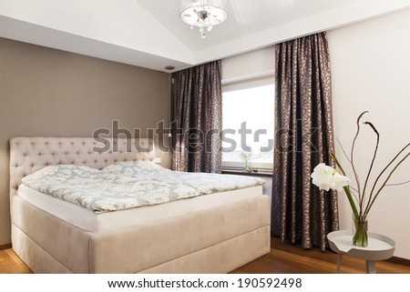 Cozy family bedroom interior - double bed and window