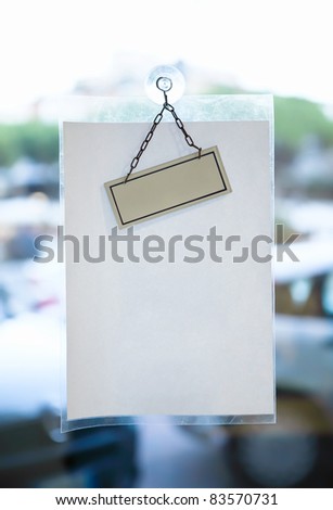 Blank paper sheet for message on glass office door