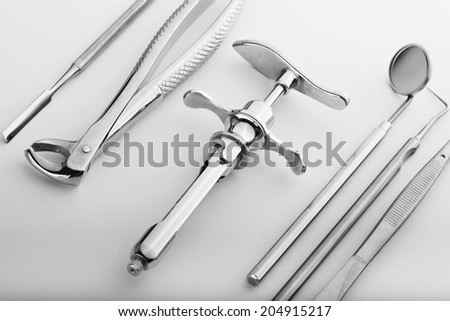 Stylish still life with dental tools on a gray background