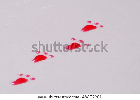 red foot print of small dwarf in the tea on the white desk