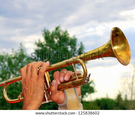 African american male trumpet player performing with a hand injury.