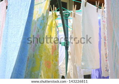 Wash day with towels hanging on the line to dry.
