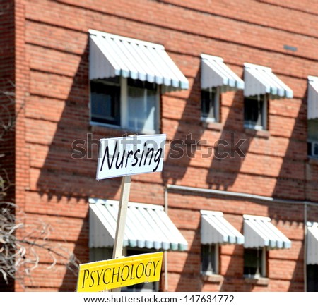 Nursing, psychology job fair signs displayed outdoors.