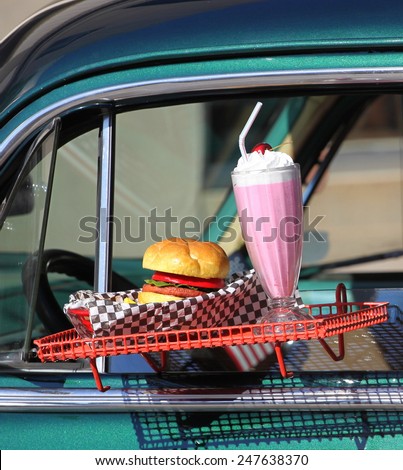 Fast food drive in diner with burger and shake.
