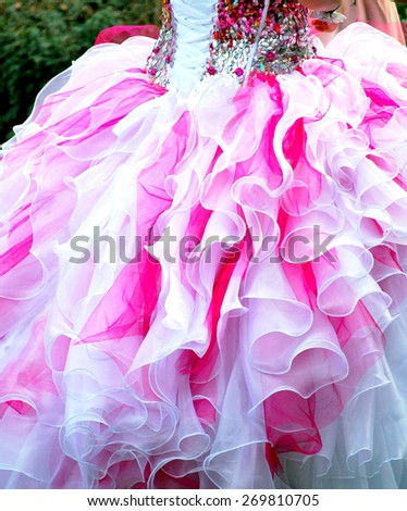 Quinceanera gown worn by female at her coming out ceremony.