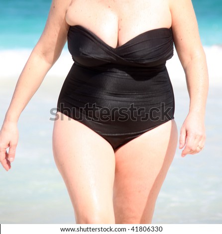 Full figure woman enjoying her beach vacation.