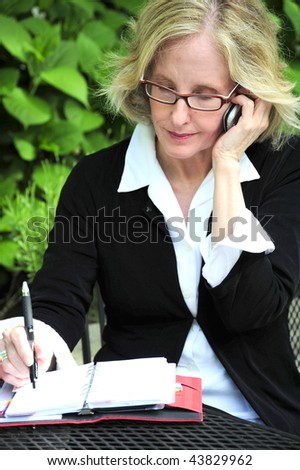 Businesswoman making an appointment.