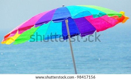 Beach umbrella for protection from the sun.