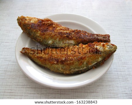 This is fired fish on white plate