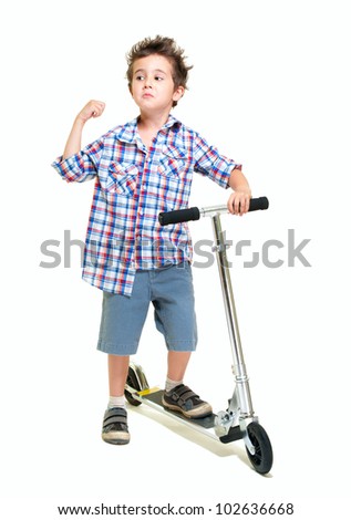 Naughty hairy little boy in shorts and shirt with scooter isolated on white