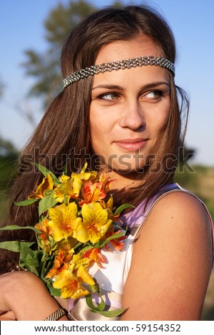 stock photo Hippie girl with lily outdoors in summer