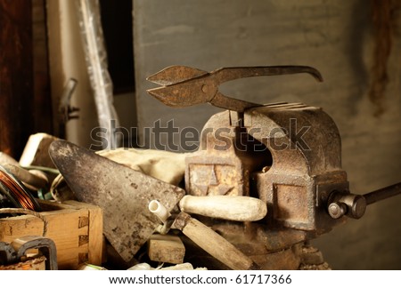 Old workshop. Rusted shears, clump and trowel