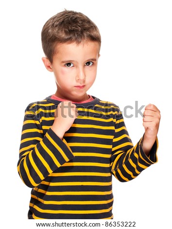 Little bully boy with black eye in fighting stance isolated on white