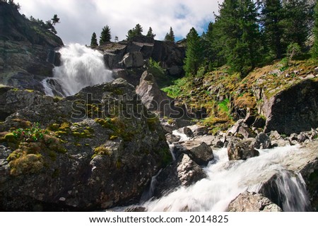 Big waterfall and mountain. Altay. Russia.