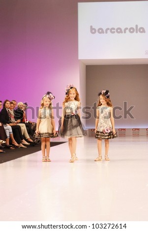 MOSCOW-SEPTEMBER 5:Unidentified children show a festive clothes barcarola Spanish brand on the international  Fashion Fair on September 5, 2011 in Moscow