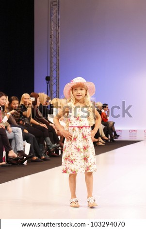 MOSCOW-SEPTEMBER 5:Unidentified child shows holiday clothing brand KINDERIT Finland at the International Fashion Fair on September 5, 2011 in Moscow