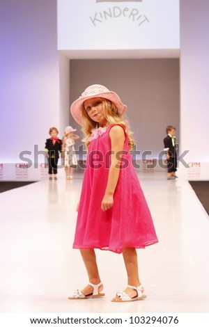 MOSCOW-SEPTEMBER 5:Unidentified child shows holiday clothing brand KINDERIT Finland at the International Fashion Fair on September 5, 2011 in Moscow