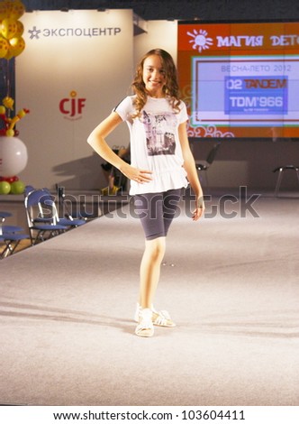 MOSCOW - SEPTEMBER 29:Unknown model shows children\'s clothing brand of Italian TANDEM Collection Premiere Moscow children at the International Fashion on September 29, 2011 in Moscow