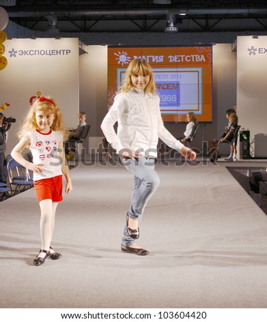 MOSCOW - SEPTEMBER 29:Unknown model shows children\'s clothing brand of Italian TANDEM Collection Premiere Moscow children at the International Fashion on September 29, 2011 in Moscow