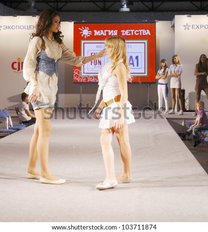 MOSCOW - SEPTEMBER 29: Unidentified models show children\'s clothing brand of Italian FUN&FUN girl Collection Premiere Moscow children at the International Fashion on September 29, 2011 in Moscow, Russia.