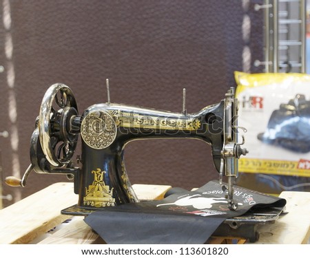 MOSCOW-AUGUST 30:Old German SINGER sewing machine on the stand of the Israeli company Hadar Rosen on sewing automotive seat covers at the International Exhibition INTERAVTO on August 30,2012 in Moscow