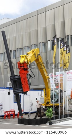 MOSCOW-JUNE 22:Mounted vibrator of the Finnish company MOVAX on the excavator brand NEW HOLLAND at the INTERNATIONAL OIL & GAS EXHIBITION on June 22, 2011 in Moscow