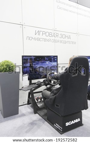 MOSCOW, SEPTEMBER 12: The simulator of the Swedish companies SCANIA for driver training at the International Exhibition COMTRANS on September 12, 2013 in Moscow