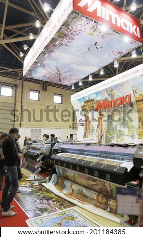 MOSCOW, April 3: Visitors are introduced to the plotters for the manufacture of stretch ceilings Japanese company Mimaki at the International Exhibition Mosbuild April 3, 2014 in Moscow