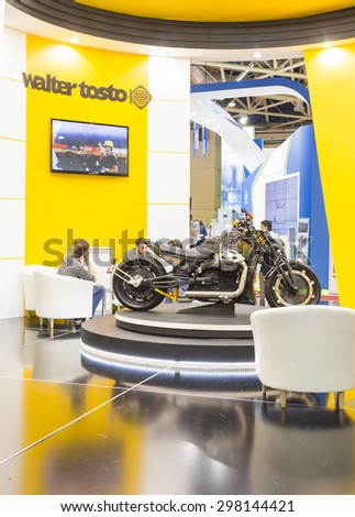 MOSCOW-JUNE 24, 2015: Motorbike managing director of Italian company WALTER TOSTO produces equipment for the oil refining industry at the International Trade Fair MIOGE