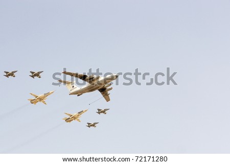 MOSCOW - MAY 9: Imitation of refueling in air of two rocket carriers from the plane of the tanker on air parade in Moscow on May 9, 2010