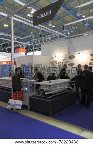 MOSCOW-APRIL 4: Customers visiting the exhibits of Europe\'s largest trade show MosBuild 2011, which was opened by Prince Philippe of Belgium on April 4, 2011 in Moscow, Russia.