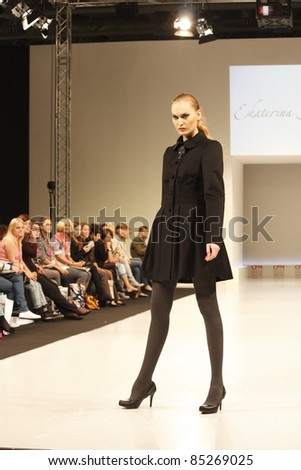 MOSCOW-SEPTEMBER 5: A model walks down the runway wearing Russian fashion designer Ekaterina Smolina at  the International Fashion Fair on September 5, 2011 in Moscow, Russia.