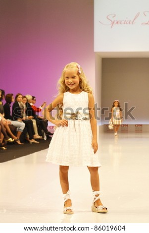 MOSCOW-SEPTEMBER 5:An unidentified model walks down the runway wearing Italian brand Special Day collection premiere Moscow Kids at  the International Fashion Fair on September 5, 2011 in Moscow, Russia.