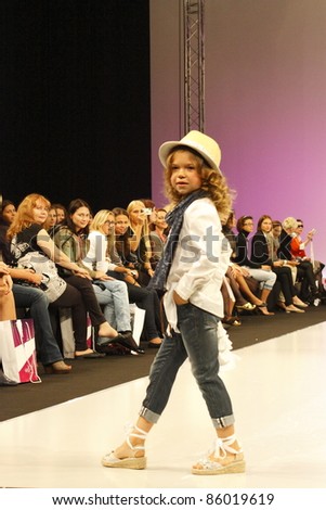 MOSCOW-SEPTEMBER 5:An unidentified model  walks down the runway wearing Italian brand Special Day collection premiere Moscow Kids at  the International Fashion Fair on September 5, 2011 in Moscow, Russia.