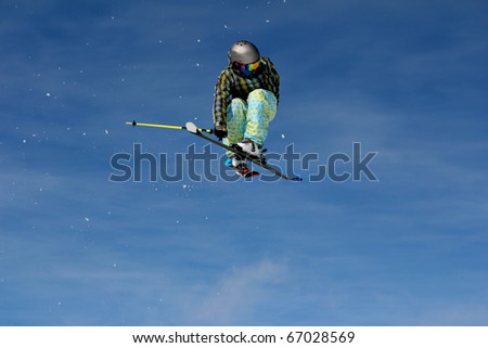 Snow skier freestyle air jump
