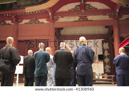 Priests advocating a sutra at the front of Enryakuji temple ,Konpotyudo, Kyoto Japan.