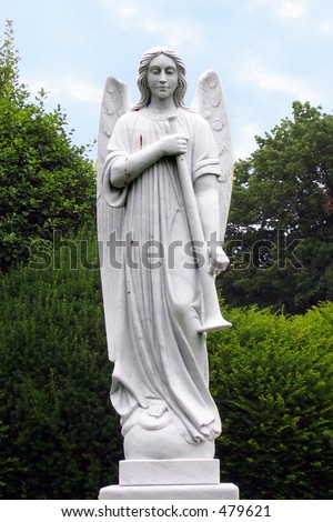 Angel sculpture. Angel with trumpet statue.
