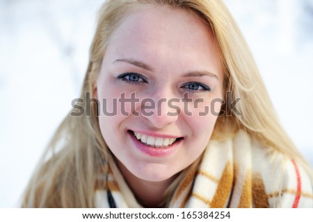 Outdoor close-up portrait of beautiful young woman