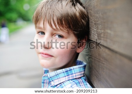 Close-up portrait of adorable kid boy outdoor