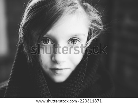 Close-up  retro portrait of brunette child girl, in knitted snood sepia tone added