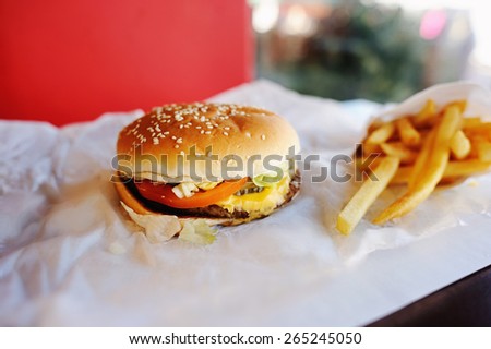 Closeup of burger and potatoes in the restaurant
