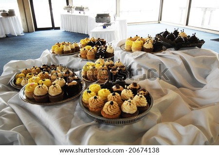 An elegant assortment of cupcakes at a wedding.