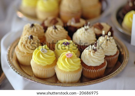 A tray of cupcakes at a wedding reception.